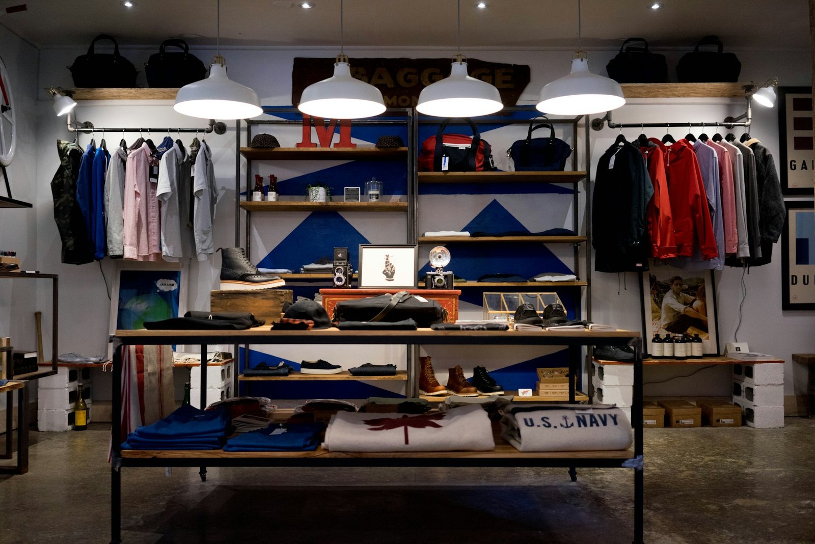Refined retail interior with warm light and tailored garments