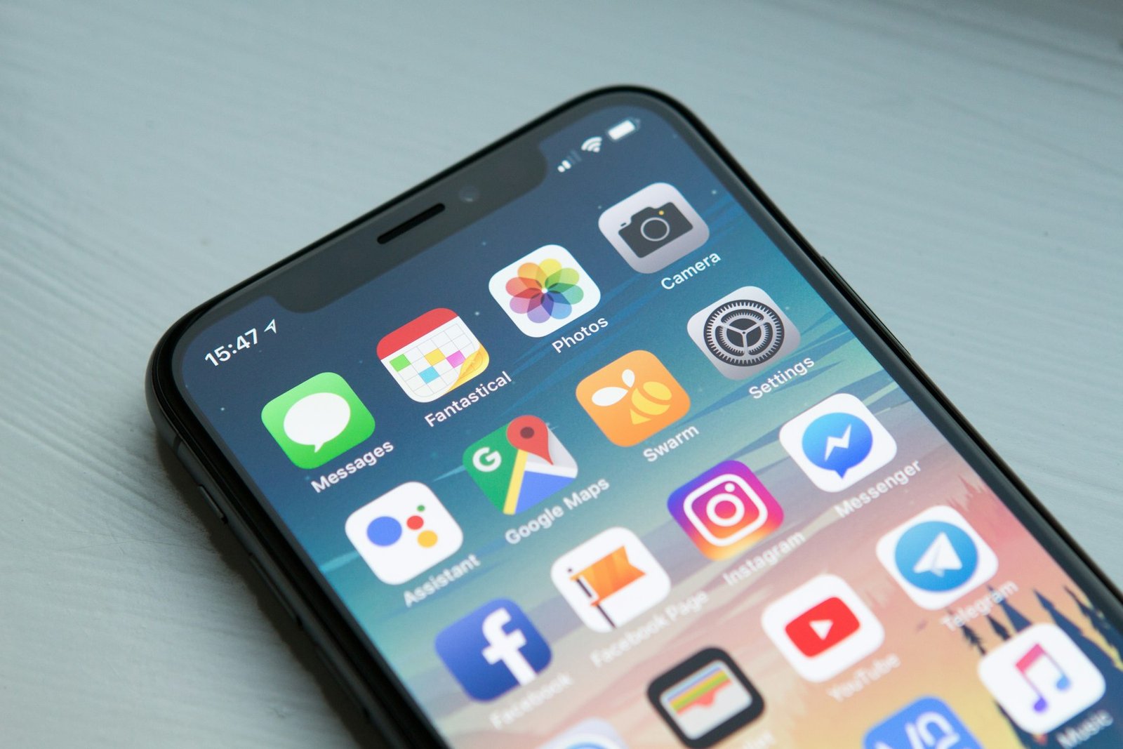 Person holding a smartphone with a focused composition